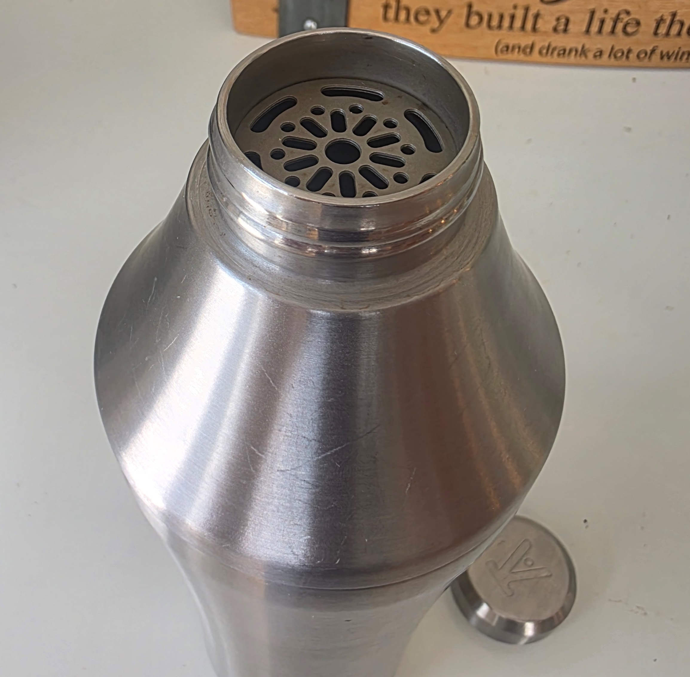 Strainer and branded cap