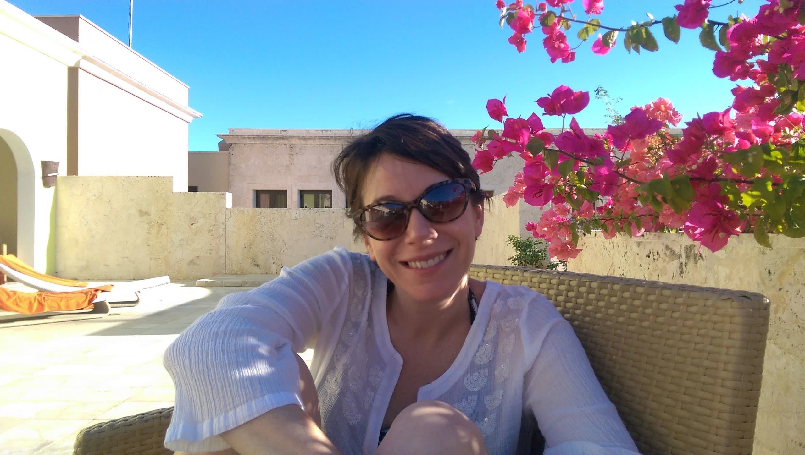 Mrs. Questionable smiling outdoors